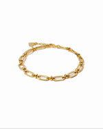 closeup image of gold chain link bracelet