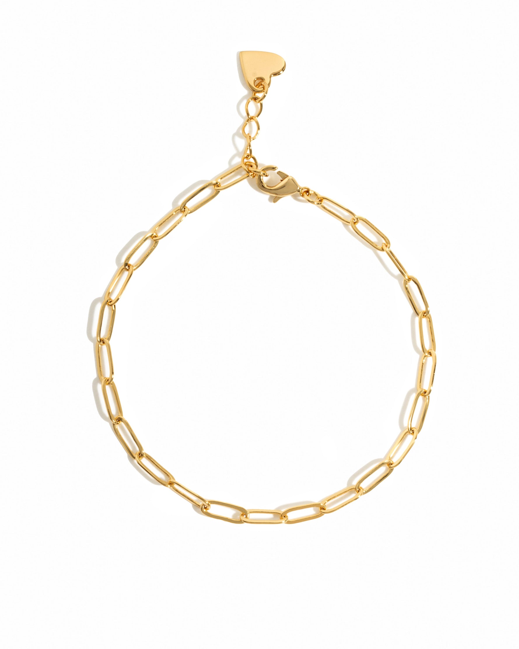 Gold paperclip chain bracelet on white background