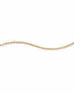 textured stackable gold bracelet on a white background