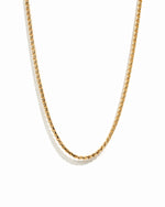 Gold chain necklace on a white background
