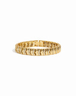 Gold stackable diamond tennis bracelet on a white background 