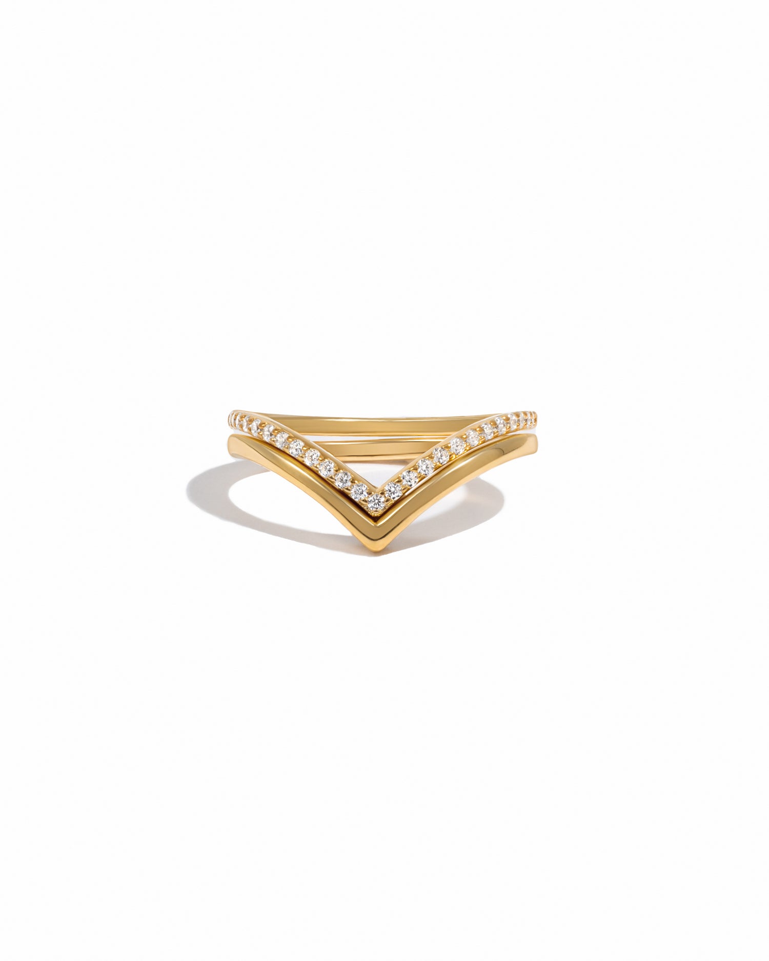 Gold chevron ring set on white background.