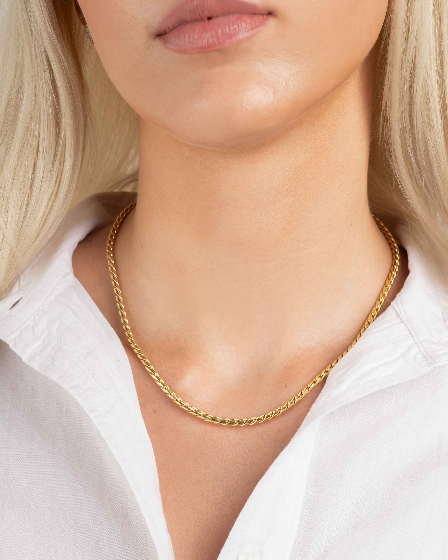 Gold rope chain necklace on model