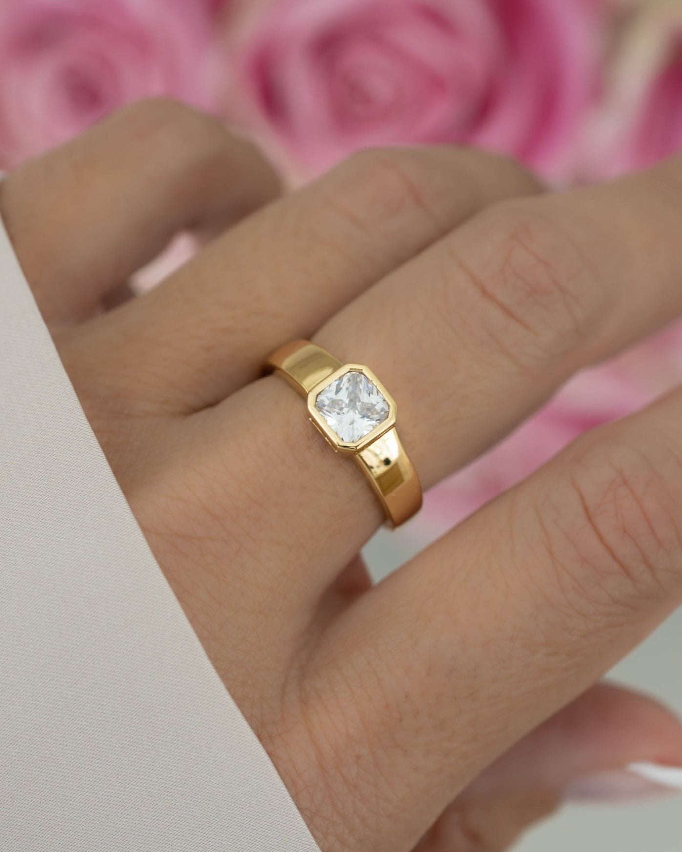 Gold stackable dome ring on model