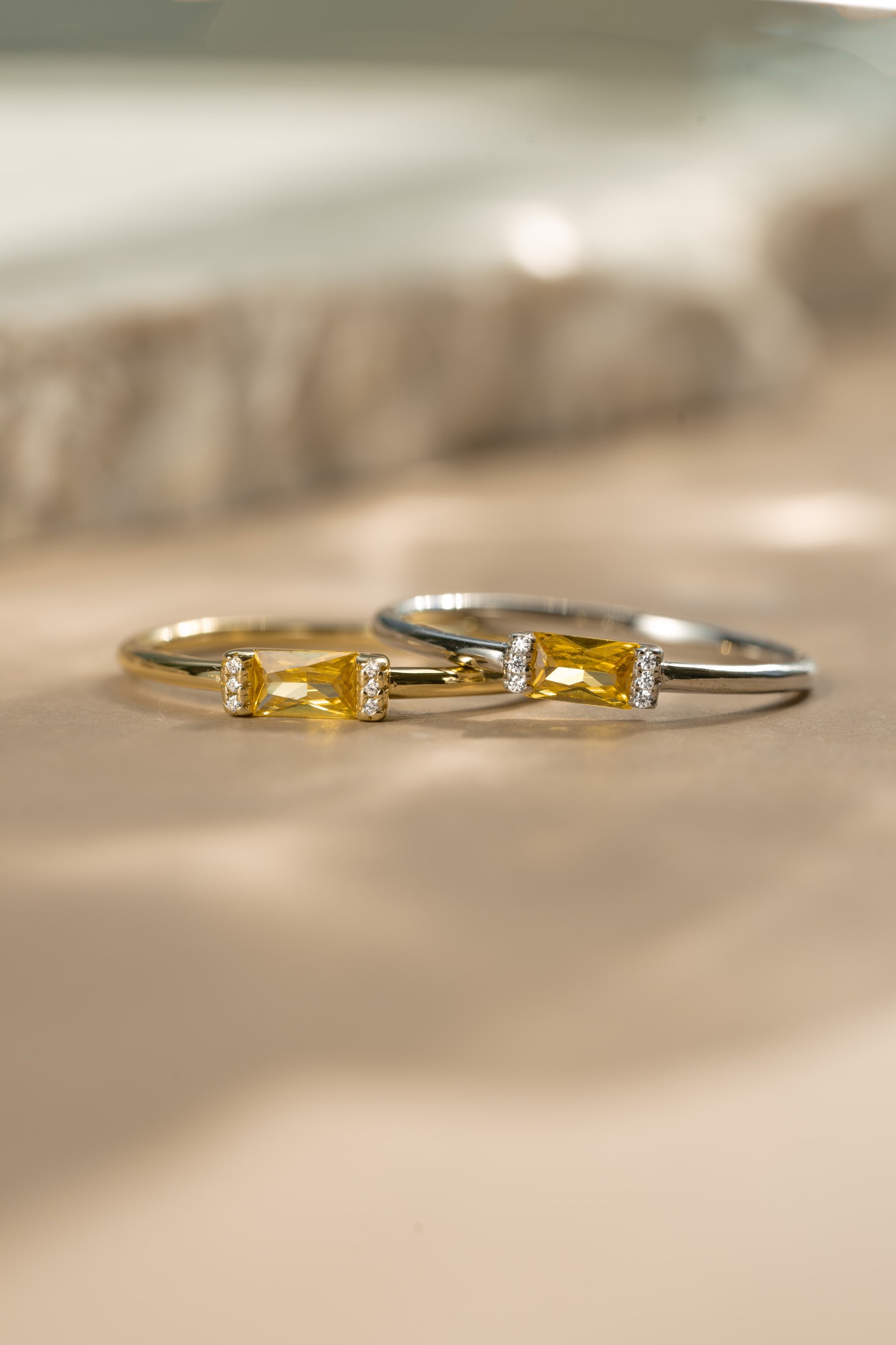Gold birthstone jewelry featuring a gold birthstone ring and a matching sterling silver gemstone ring