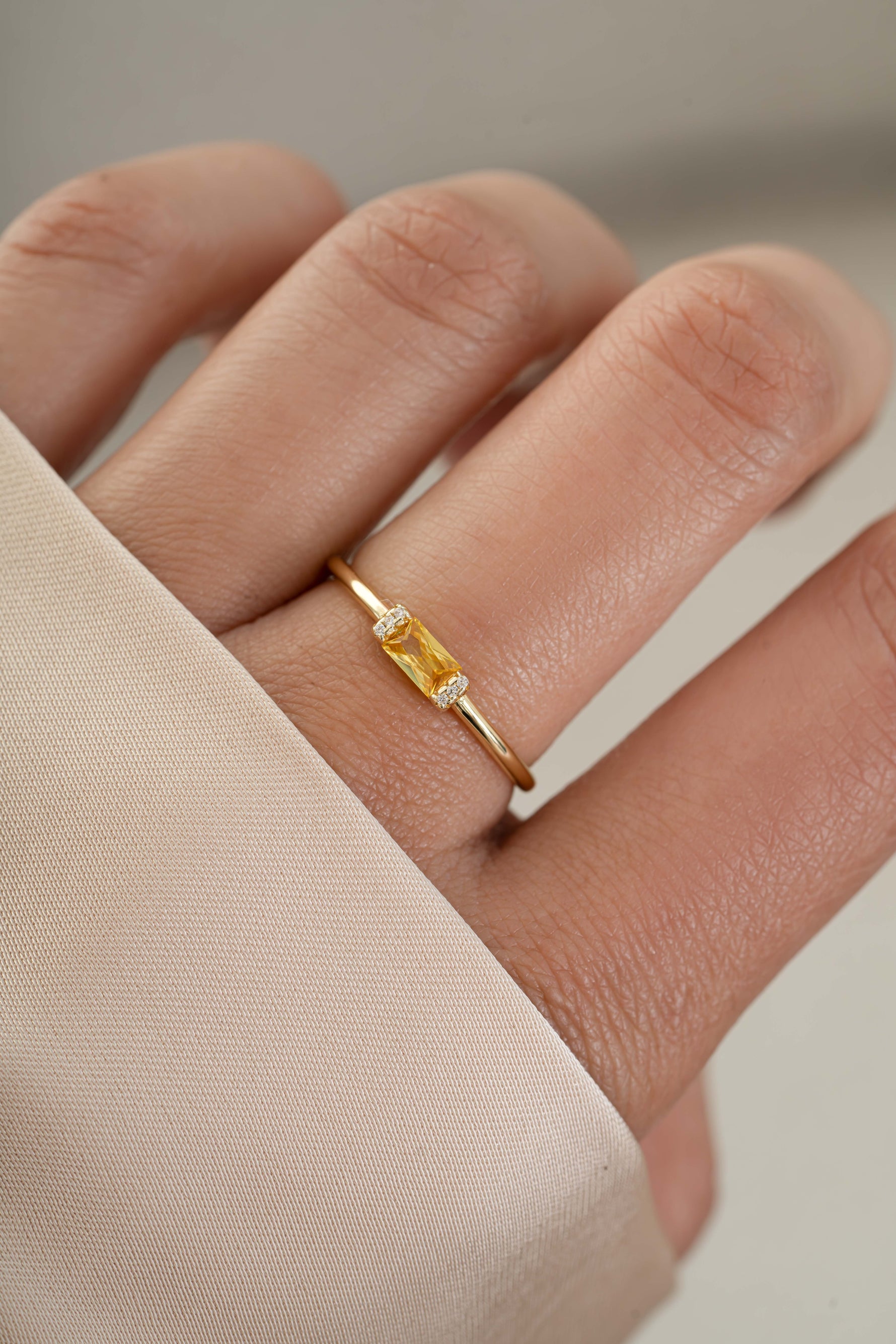 Gold citrine birthstone ring on model