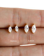 2 pairs of marquise cut diamond earrings on a hand with size measurements indicated.