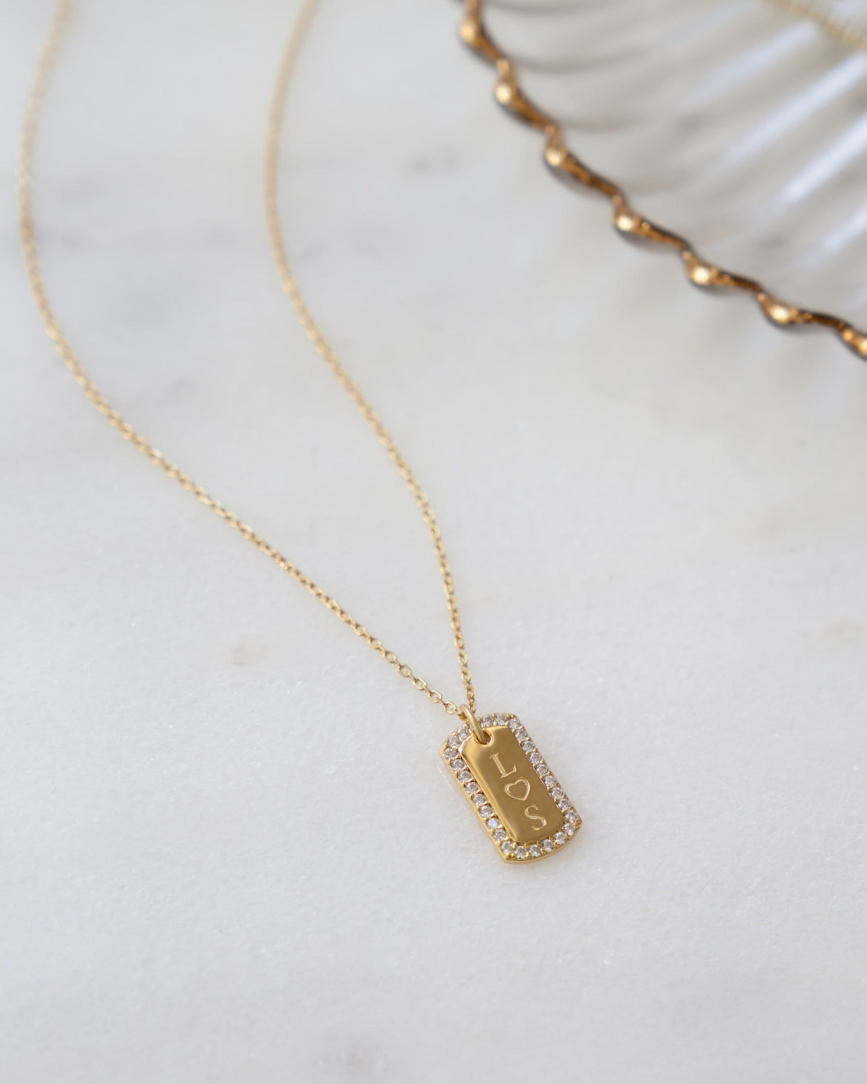 gold personalized jewelry featuring a custom bar necklace 