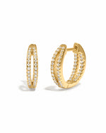 Gold double hoop earring on a white background 
