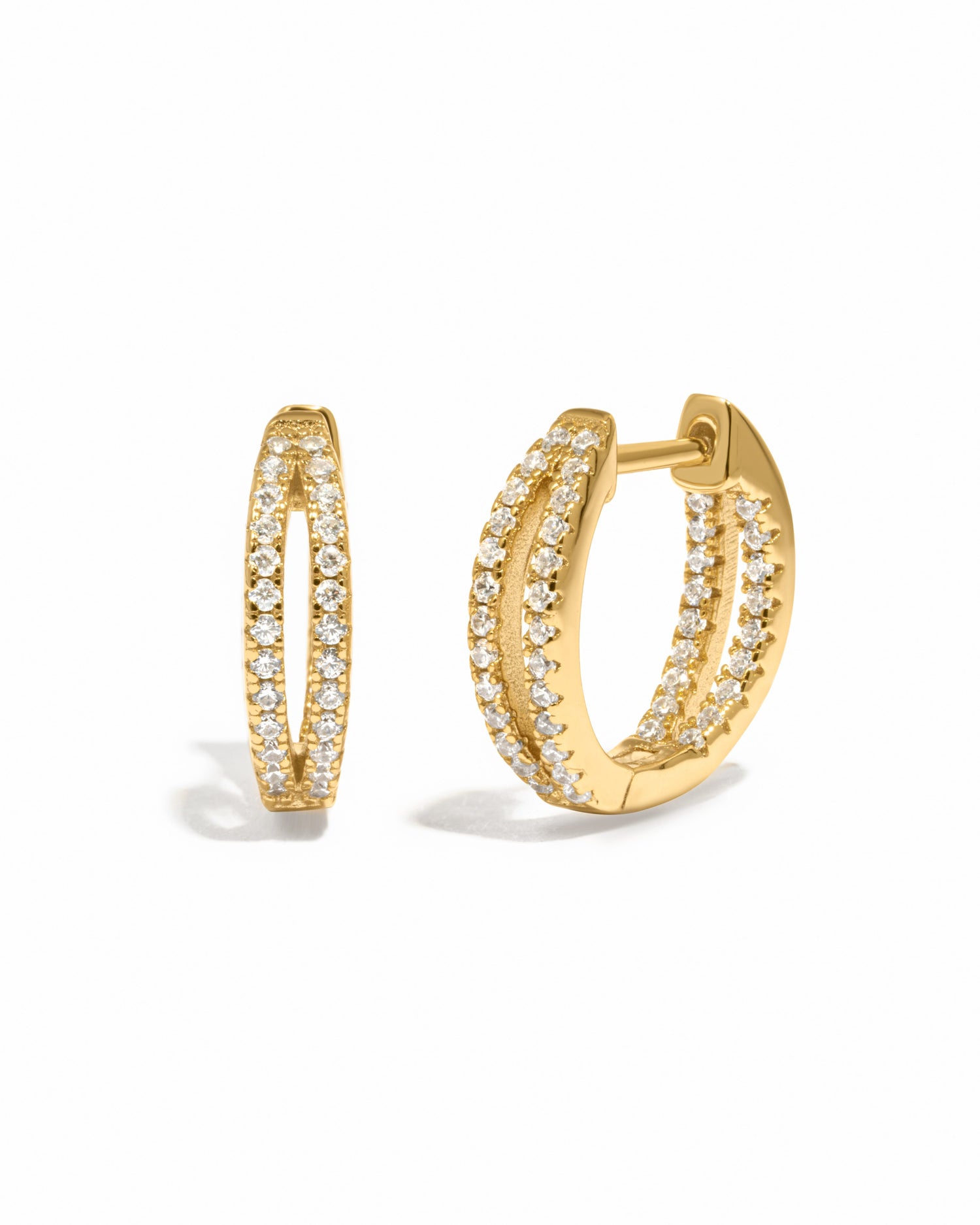 Gold double hoop earring on a white background 