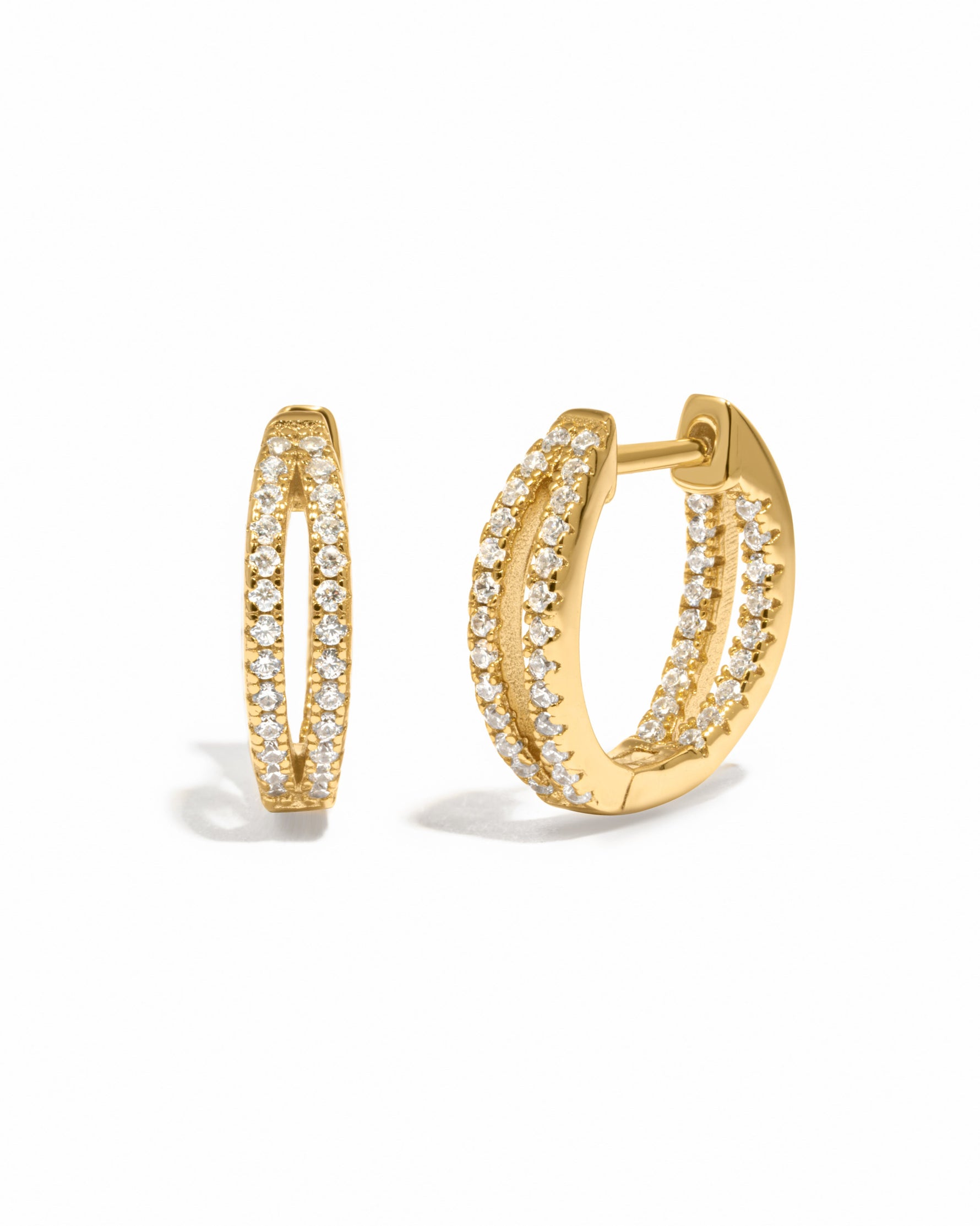 Gold double hoop earring on a white background 
