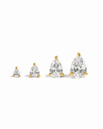 Pear cut gold stud earrings on a white background