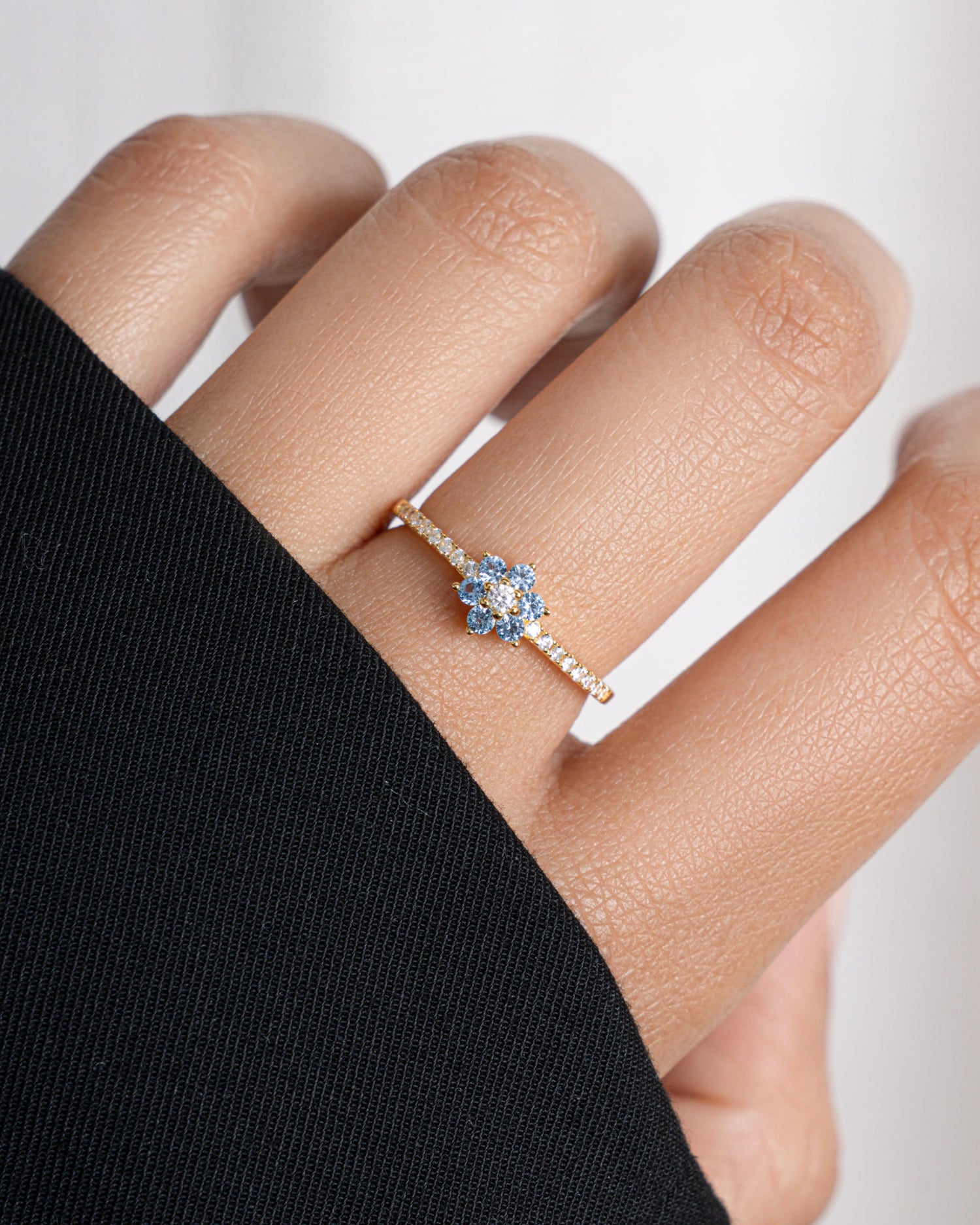 model wearing gold aquamarine stacking ring