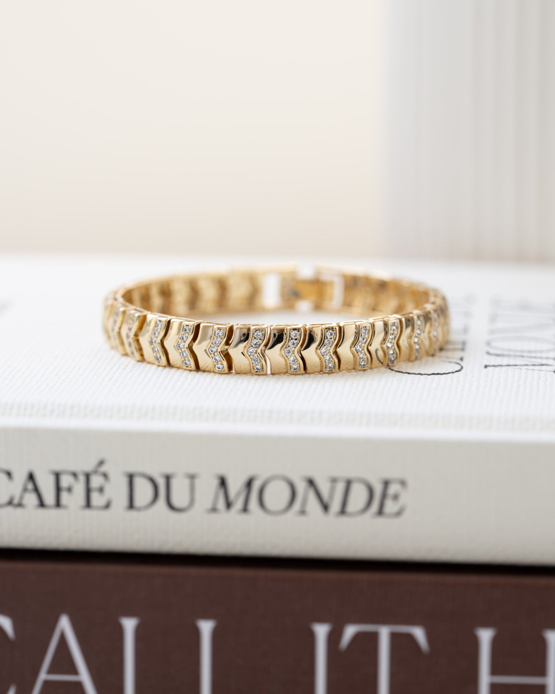 Gold statement bracelet with tennis bracelet design 