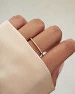 gold diamond ring on model
