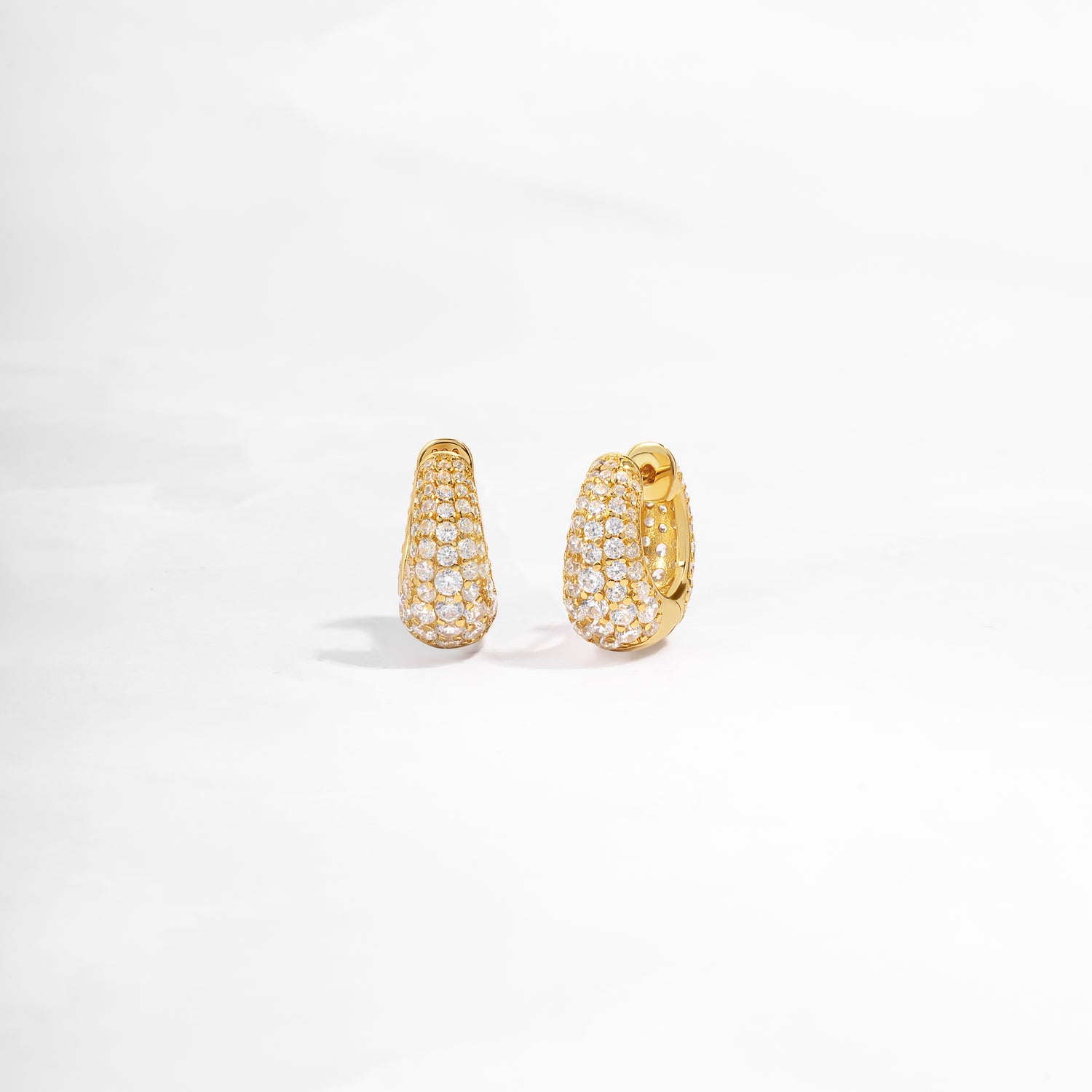 closeup view of small gold hoop earrings