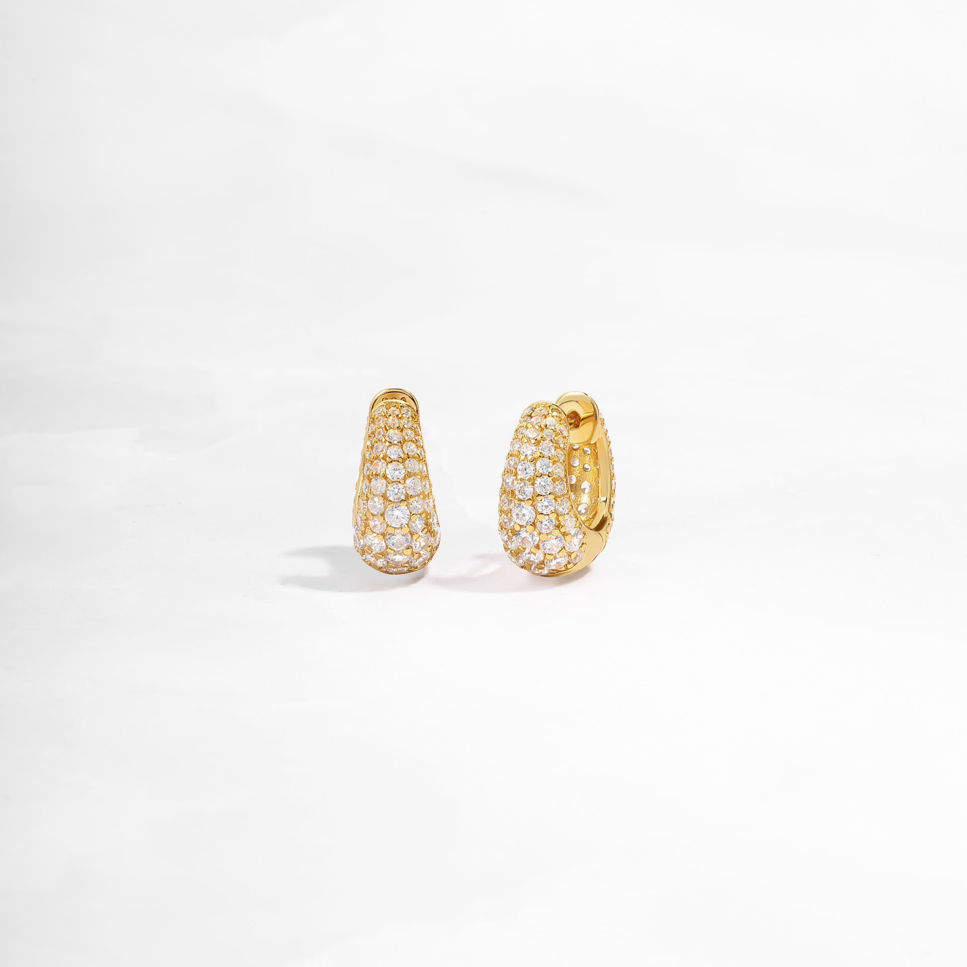 closeup view of small gold hoop earrings