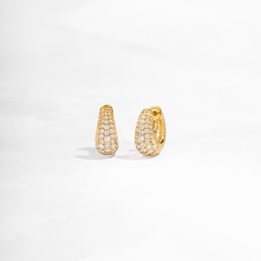 closeup view of small gold hoop earrings