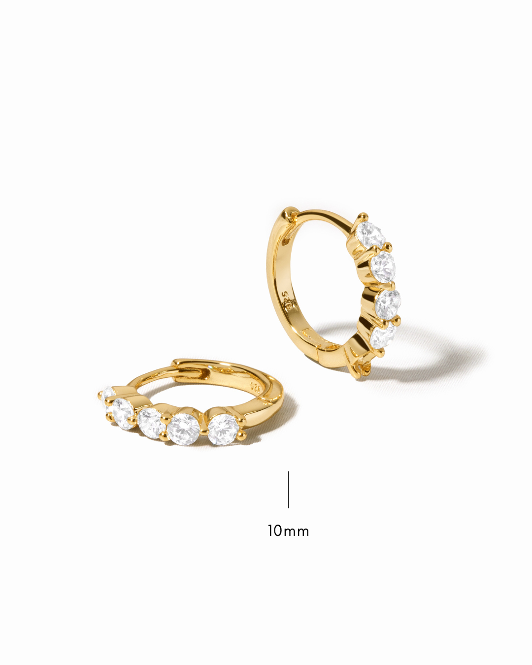mini hoop earrings with cubic zirconia stones on a white background