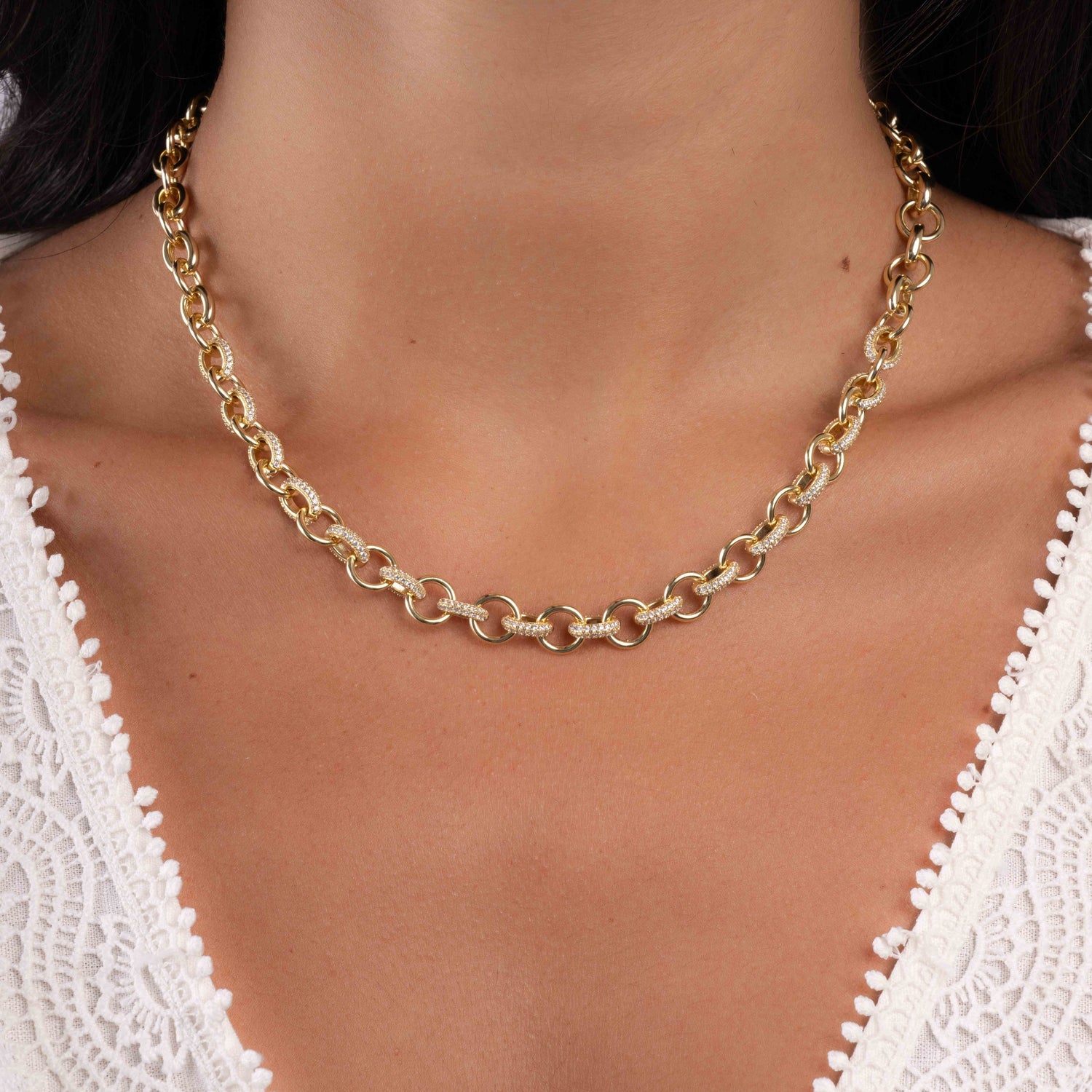 Model wearing chunky chain necklace in 14k gold plating