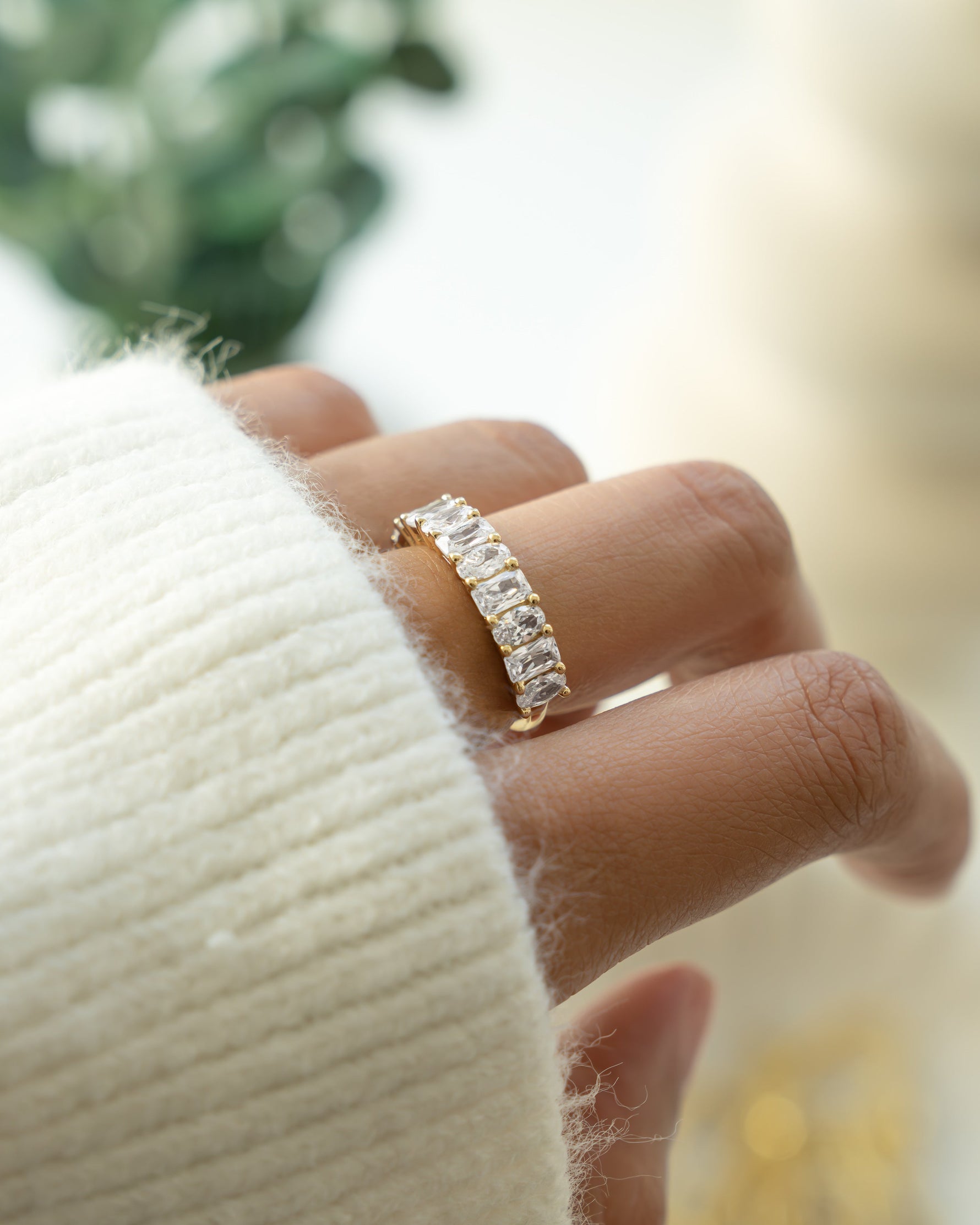 Gold oval cut and emerald cut unique stackable ring on model