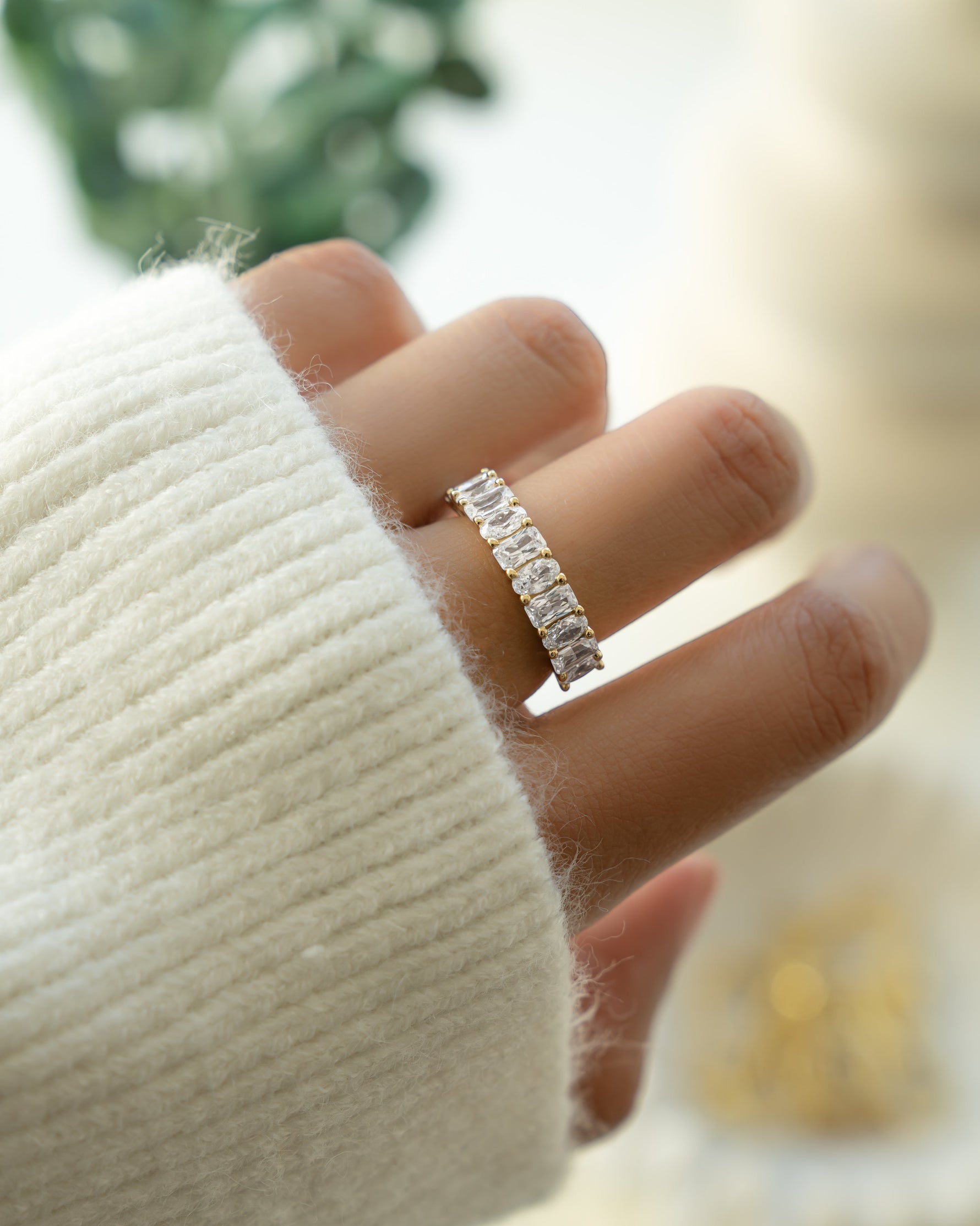 Gold stackable diamond ring on model