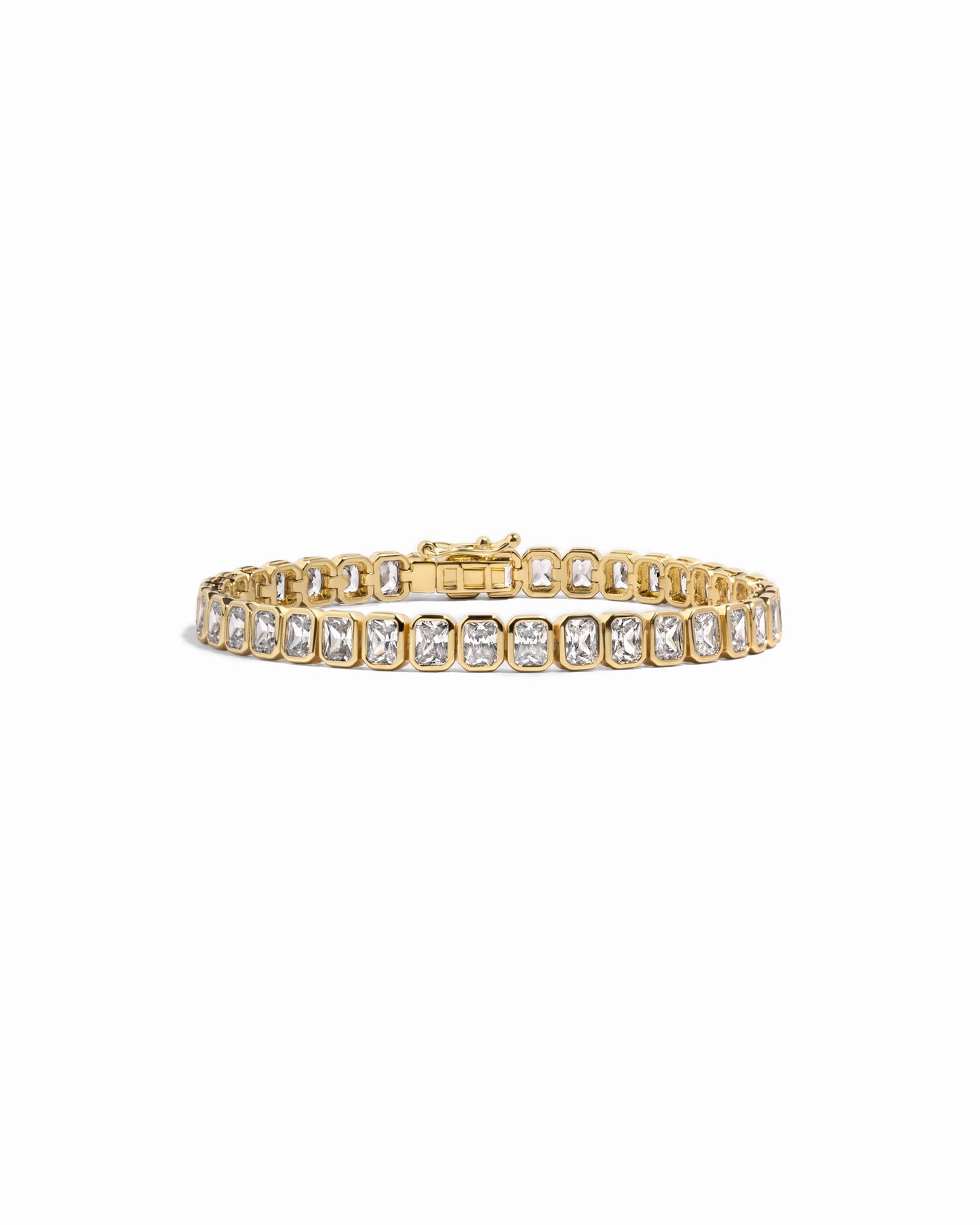 Gold emerald cut diamond tennis bracelet 