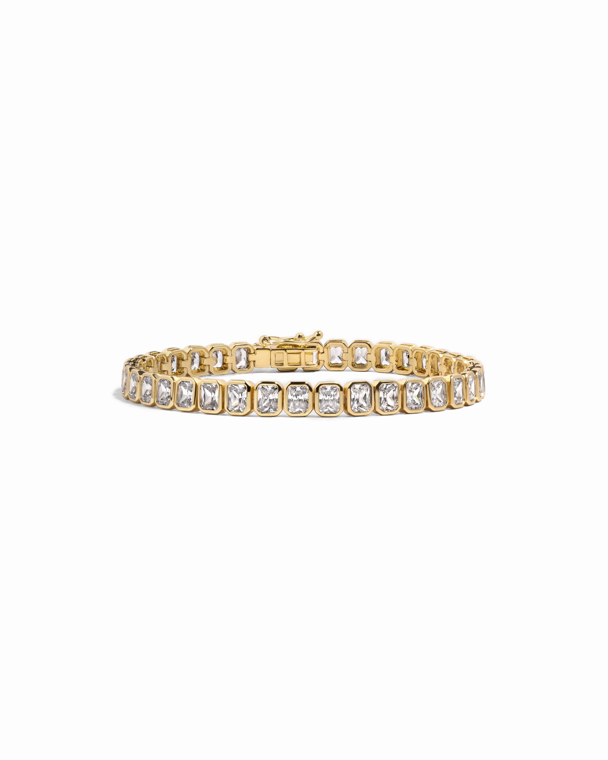 Gold emerald cut diamond tennis bracelet 