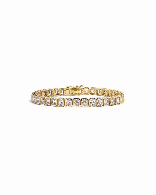 Gold emerald cut diamond tennis bracelet 