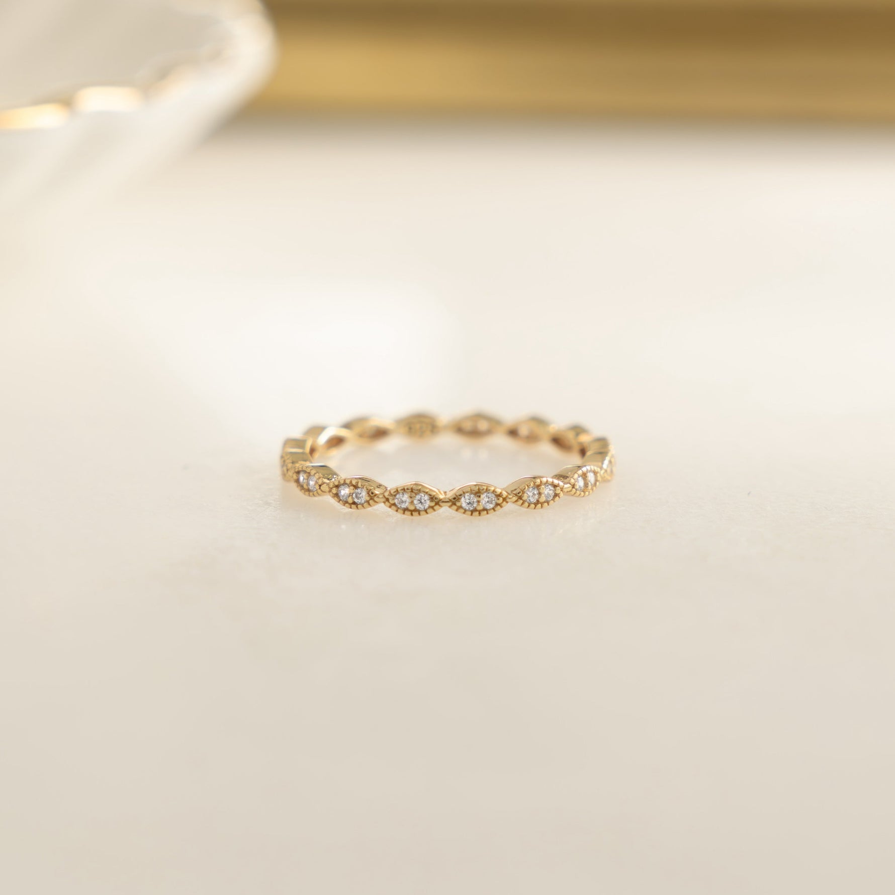 Closeup image of 14k gold eternity ring