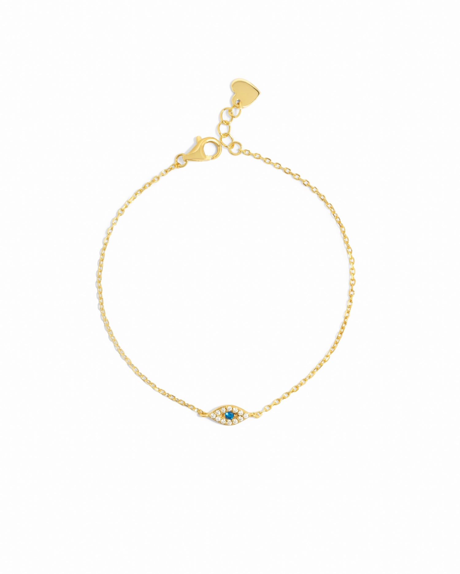 Gold bracelet with a small evil eye charm on a white background