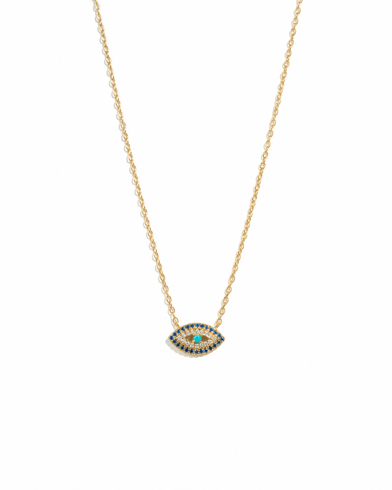 A gold chain necklace featuring a marquise-shaped sapphire evil eye pendant, displayed against a white background.