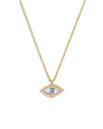 closeup image of gold evil eye necklace