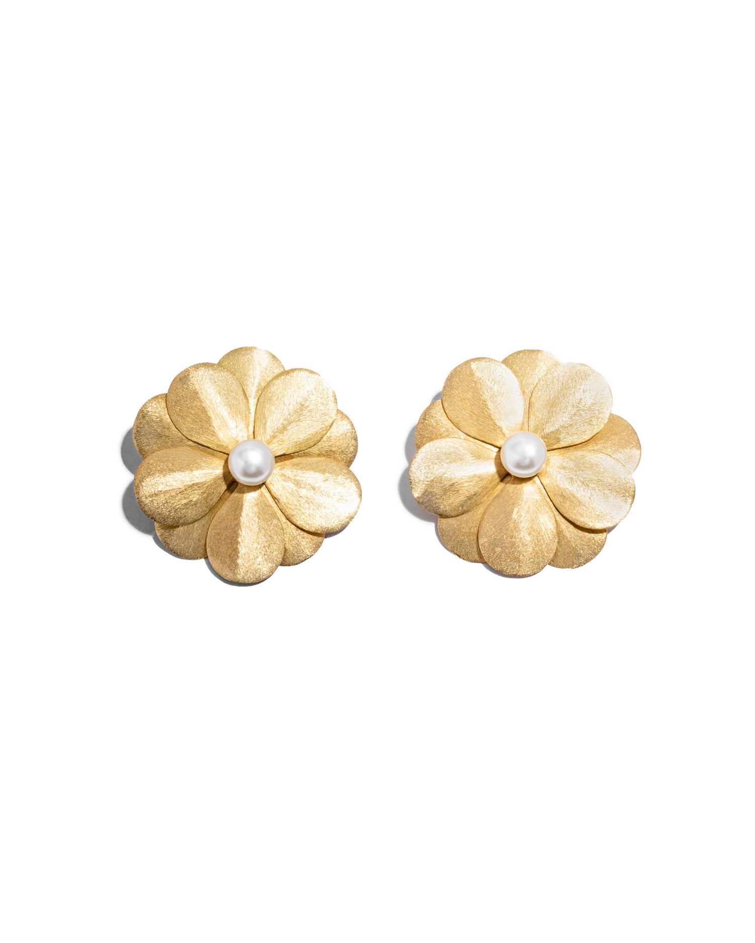 closeup image of gold flower earrings
