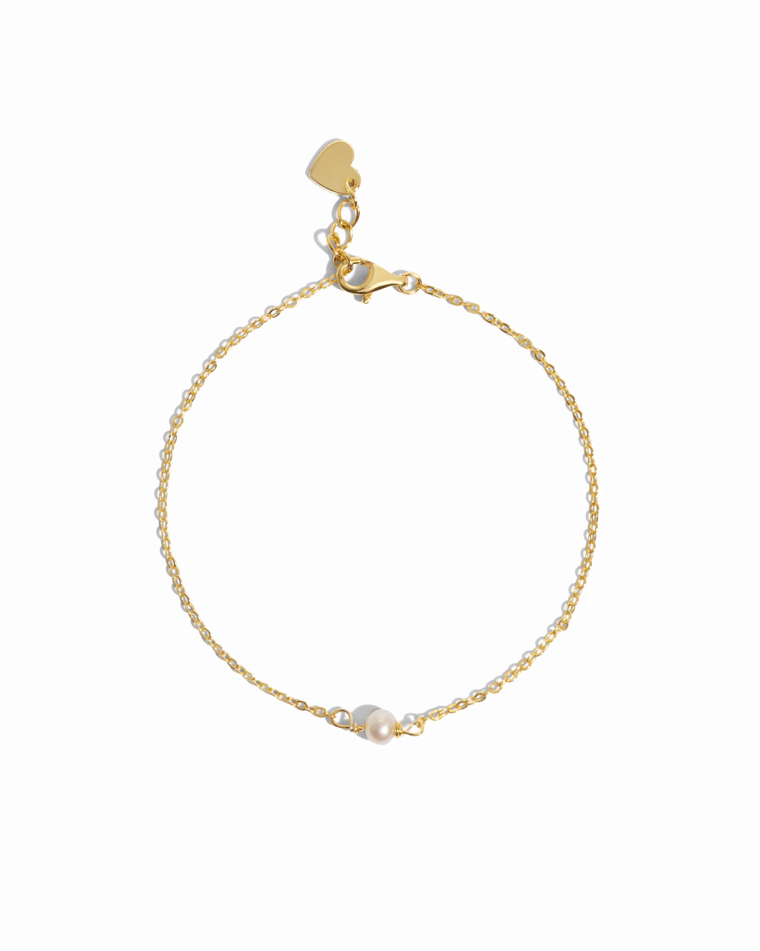 Gold bracelet with a freshwater pearl charm on a white background
