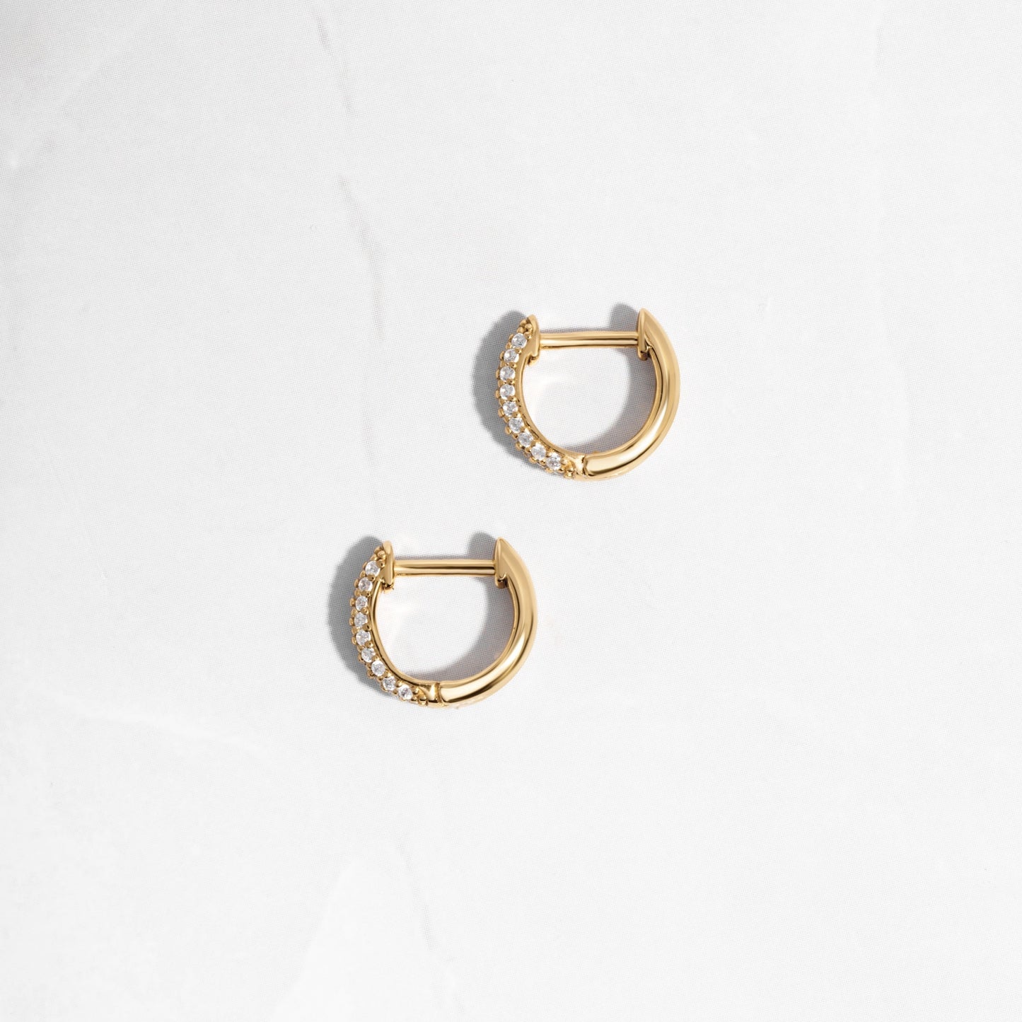 image of delicate earrings featuring a minimalist small hoop earring design 