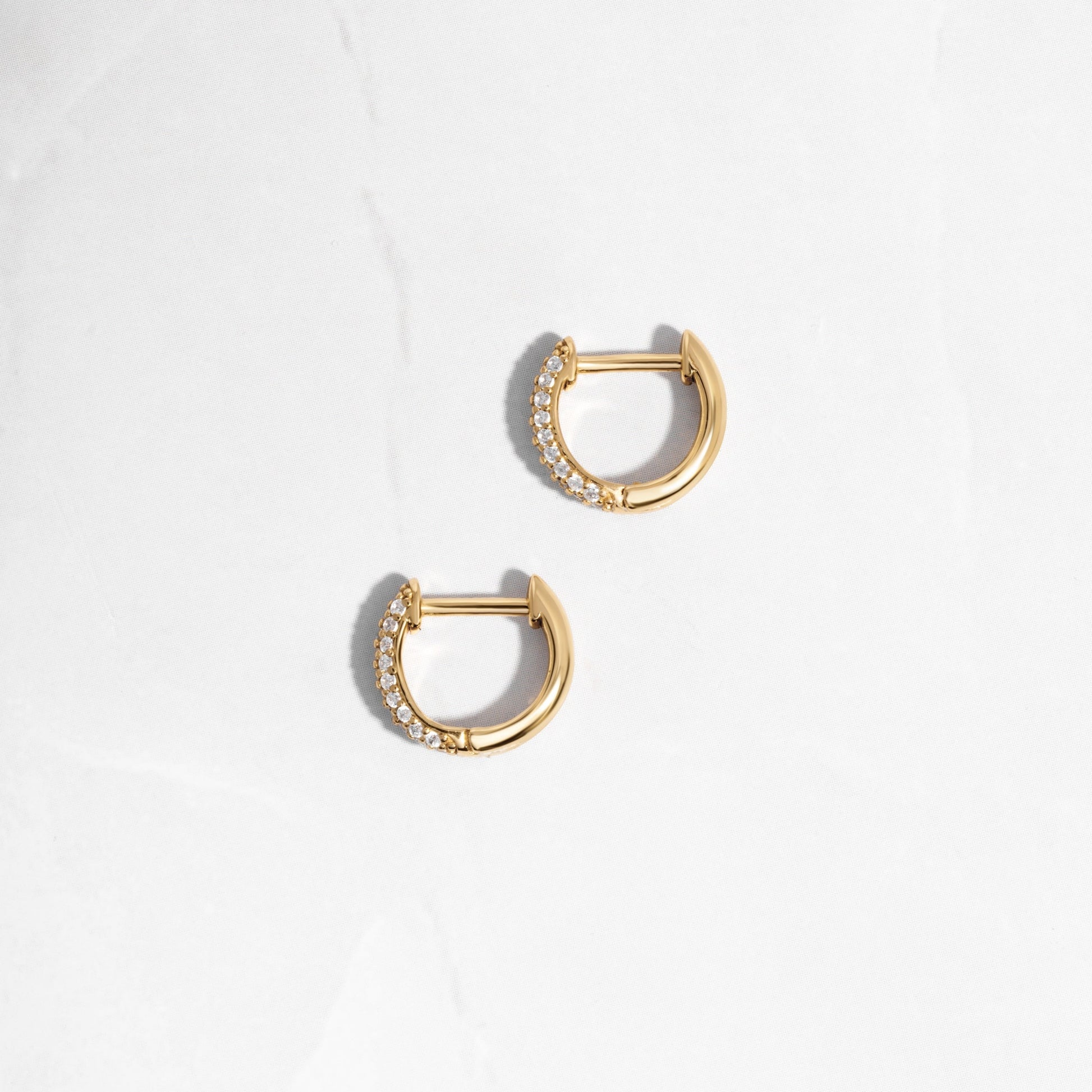 image of delicate earrings featuring a minimalist small hoop earring design 