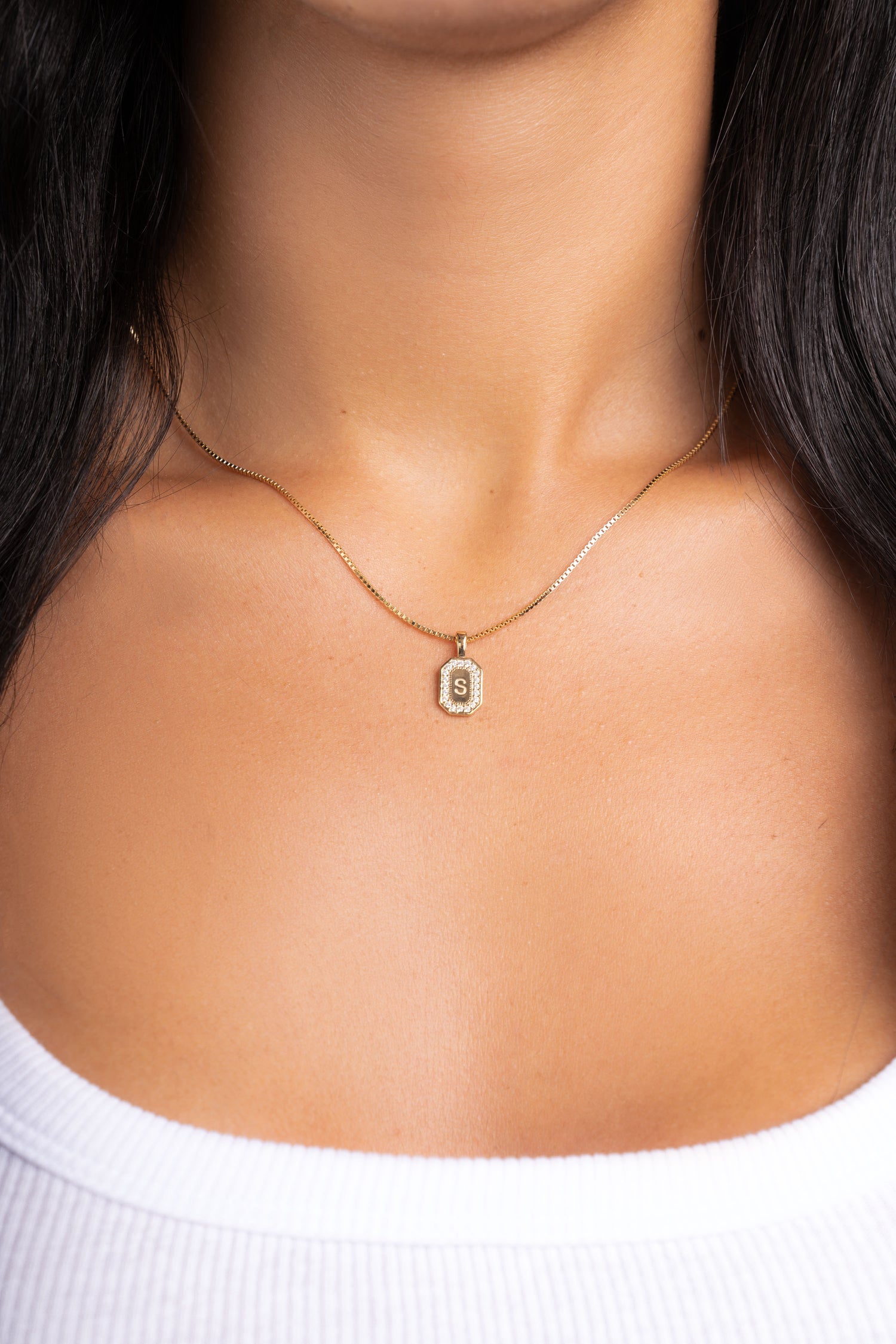 Gold initial necklace with custom diamond pendant featuring initial "S"