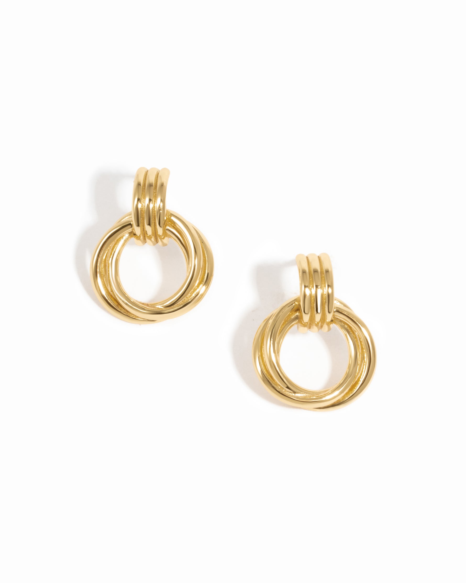 Close-up of Knot Hoop Earrings in gold, featuring a smooth, intertwined knot design.