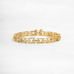 closeup of gold chain link bracelet