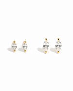 Two pairs of diamond stud earrings  on a white background