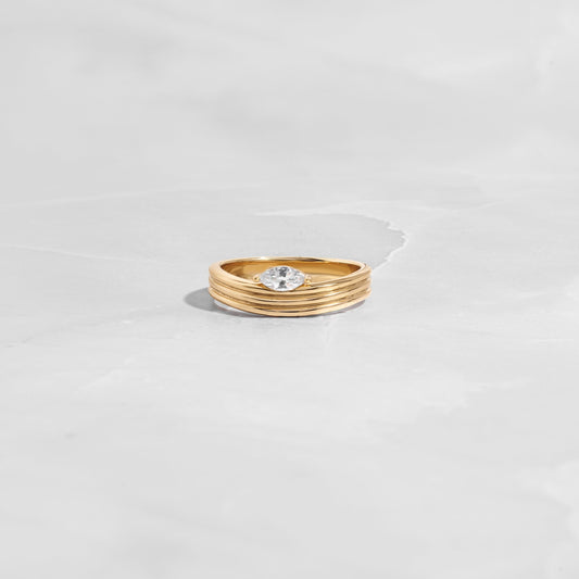closeup image of gold dainty marquise ring 