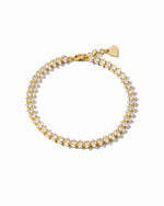 Gold marquise-cut tennis bracelet on a white background