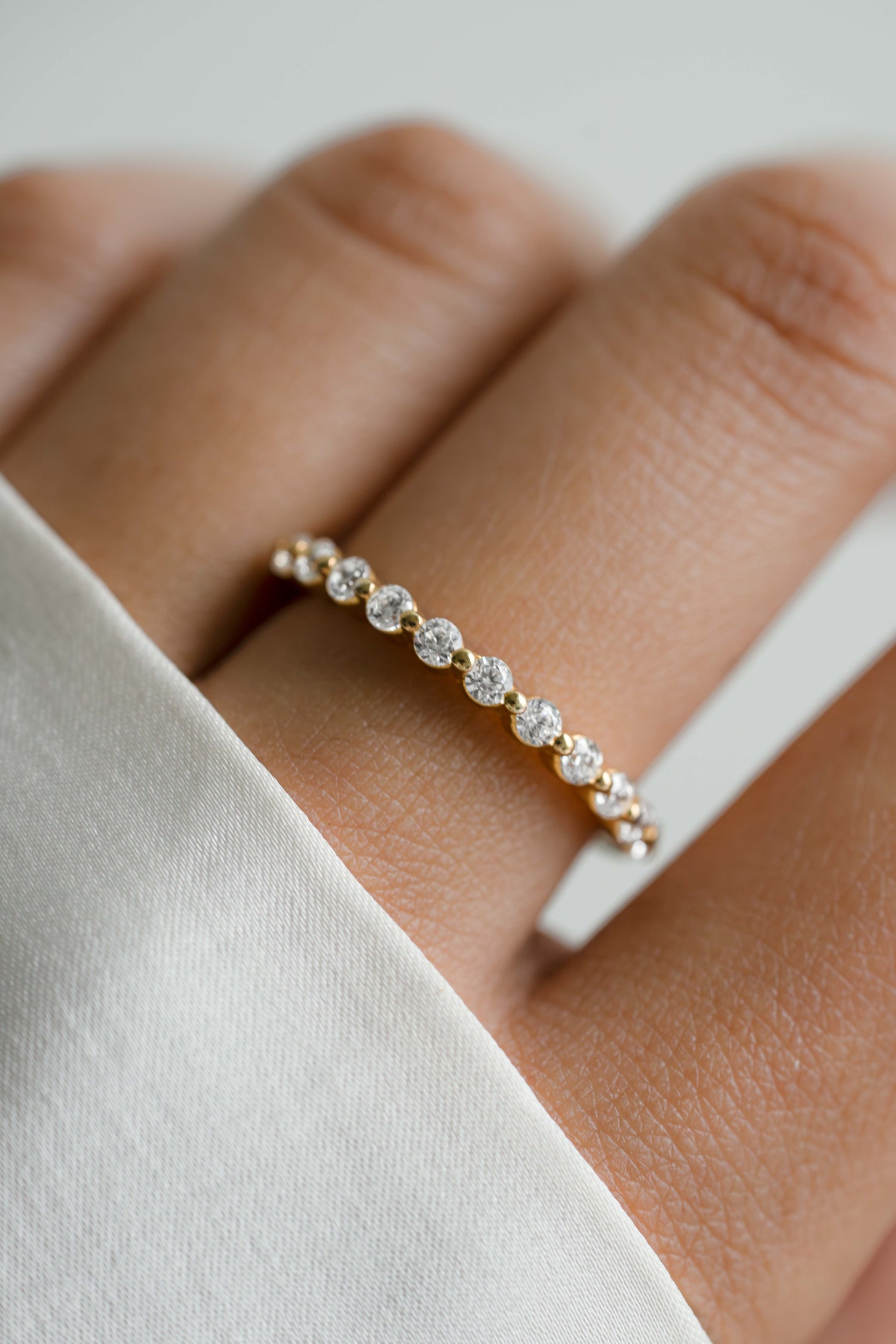 Gold dainty ring on model