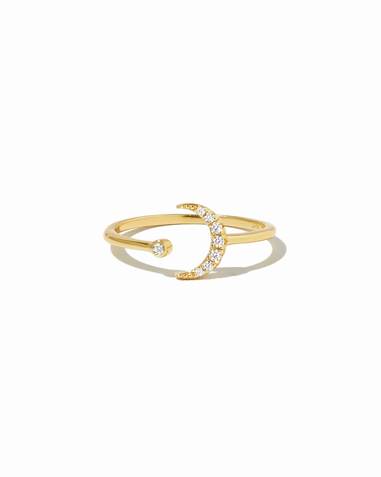 gold open moon ring on a white background