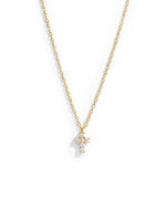 Gold necklace with a small cross pendant 