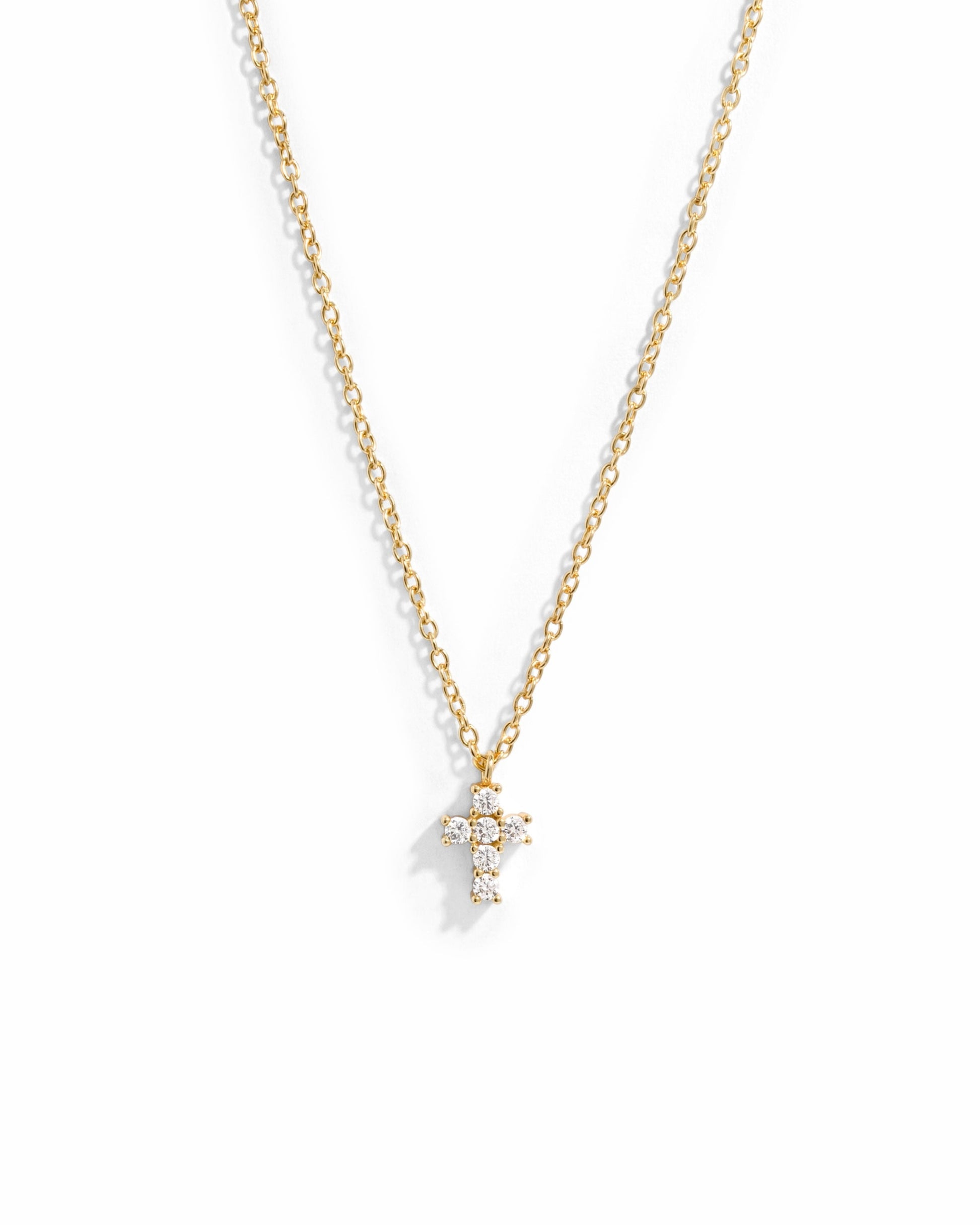 Gold necklace with a small cross pendant 