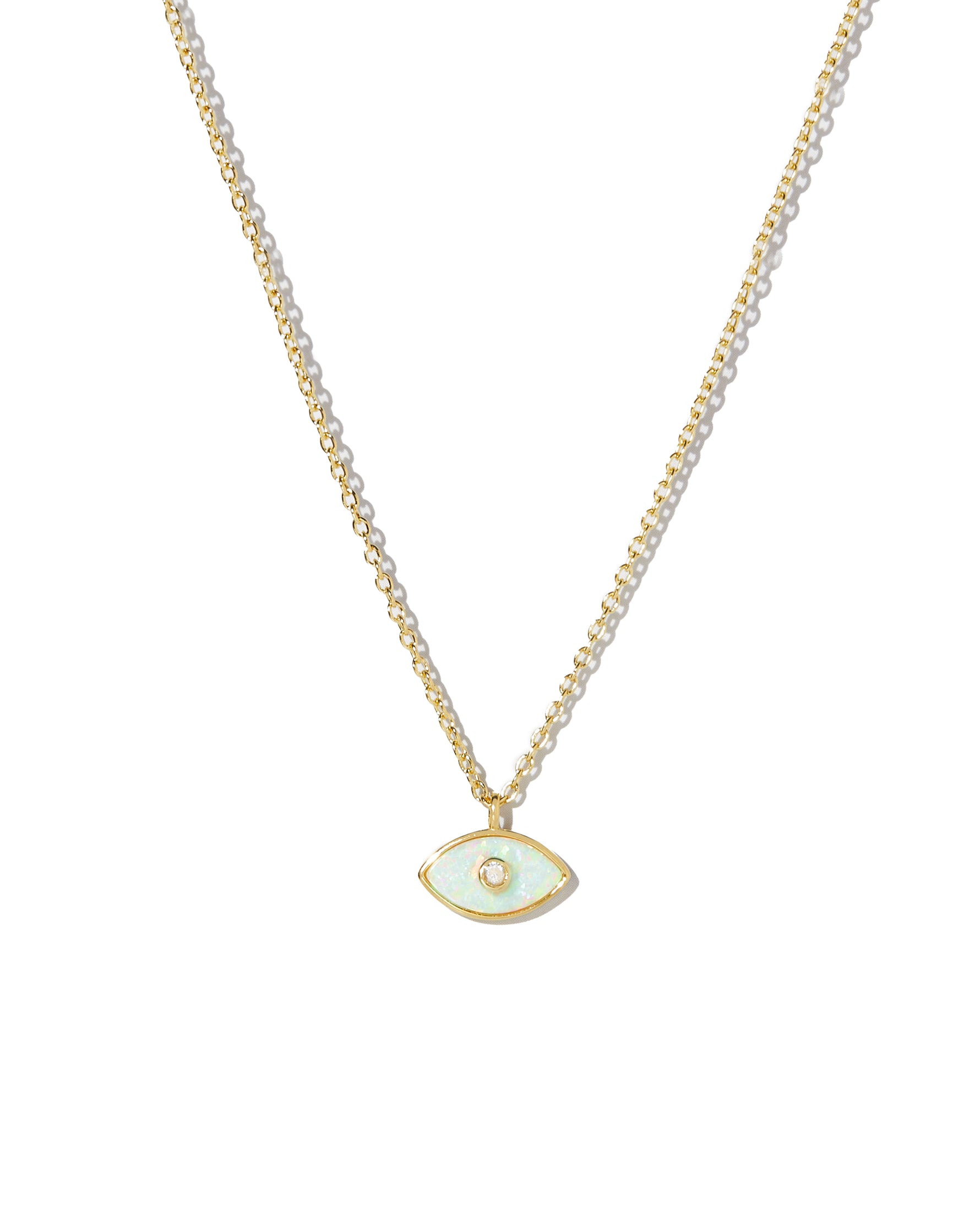 Gold necklace with a small evil eye opal pendant on a white background