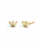Pair of gold earrings with opal stones on a white background