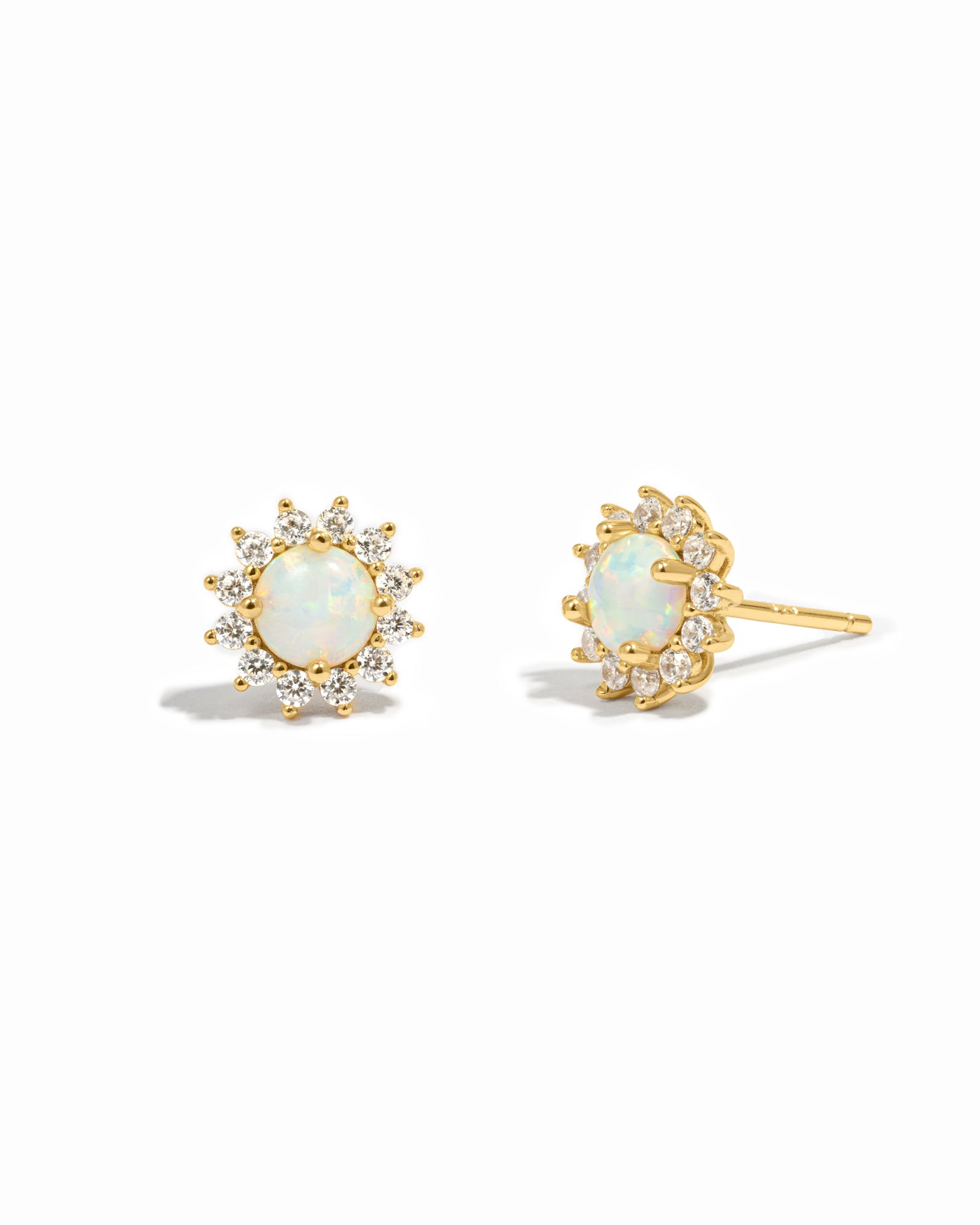 Gold opal stud earrings with diamond halo.